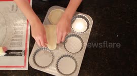 Young Woman Puts Pastry Dough In Pan