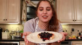 Young Girl with Blueberry Tart In Kitchen