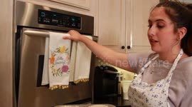 Teen girl puts pan in stove