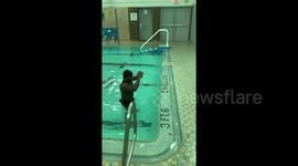 Newsflare Edit - Gymnast makes powerful jump out of 42-inch pool onto edge