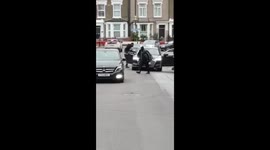 Two men smash each others' cars in broad daylight using baseball bat and machete
