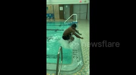 Gymnast makes powerful leap out of 42-inch pool onto edge