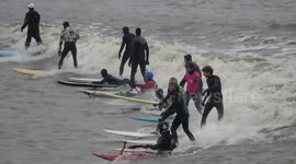 UK thrillseekers flock to Gloucester to surf year's first 'Severn Bore' wave phenomenon