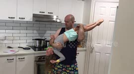 Dad plays air guitar on daughter