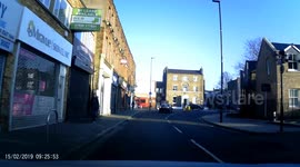 Lady BMW driver pulling out in front of car on roundabout
