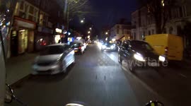 Guy crossing road infront of scooter without looking