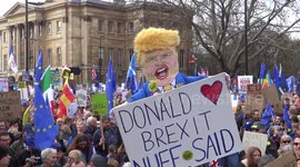 People scan Theresa May go away! at People's Vote march in London, UK