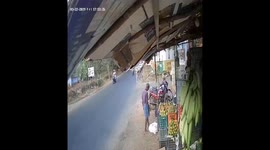 Speeding bike rams woman scooter rider who abruptly stops on road