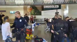 LAX airport police woman claims a pilot gave her a bag at  LAX