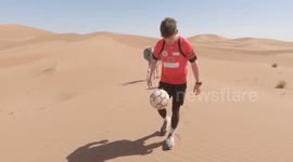 Footballer traverses 60 miles across Sahara juggling a ball every step of the way