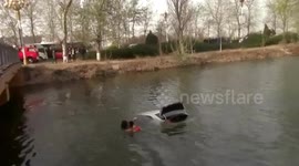 Firefighters save woman trapped in car that falls into lake in China's Hebei