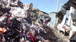 Market stalls set up among metres-high piles of garbage in Kenyan capital