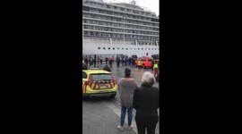 Onlookers cheer as Viking Sky cruise ship is towed into Norwegian port of Molde