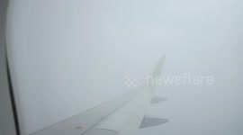 strong shock on the Citilink QG 718 plane when it penetrated a large cloud of clumps when it landed at Surabaya airport, Indonesia