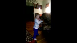 Cute child shares milk with dog