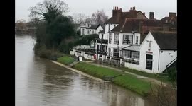 Flooding Thames reaches the level of the pontoon at the Swan Hotel, Staines