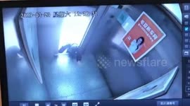 Old Chinese woman narrowly escapes death climbing out of malfunctioning elevator