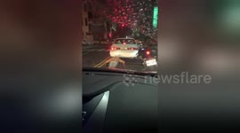 Funny moment Taiwan motorcyclist is caught doing push-ups as he waits at traffic lights