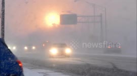 Eerie orange sunrise shines over morning traffic in New York state