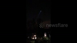 Police helicopters circle over suspected burglars standing on northwest London roof