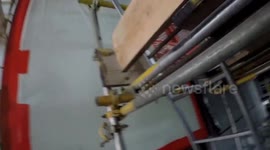 Watch these urban explorers getting hit by a hail storm as they scale 650ft building with no safety ropes