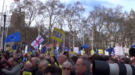 Peoples Vote rally about to begin in Parliament Square - crowds with Stop Brexit placards and EU flags opposite Parliament on 23 March 2019