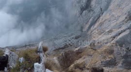 Moment a daredevil base-jumper leaps off a mountain in a wingsuit and