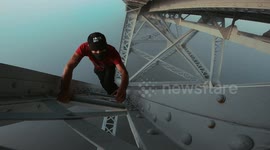 Fearless free-climber scales 'bridge over the clouds' in France
