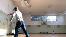 Canadian dad sinks amazing trick shot by throwing a rugby ball through basketball hoop