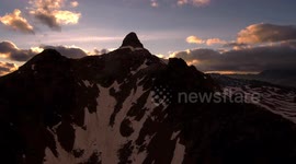 Epic Aerial Sunset Over Mountains