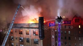 Scary moment Yonkers firefighters on crane get hit by water jet from other crew