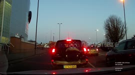 Car flips over in low-speed crash on street in Enfield