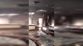 Pedestrians flee Chinese police station after homemade bomb attack