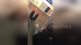 Adorable kid copies his dad's leg movements whilst watching TV