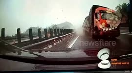 Car narrowly avoids being crushed by out-of-control transport truck