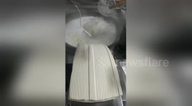 Efficient noodle-cutting machine spotted in Chinese noodle bar