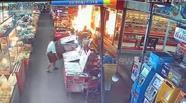 Terrifying moment market stall bursts into flames in central Thailand