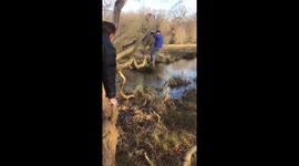 UK father dangles from tree before falling into pond