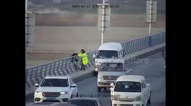 Heroic woman grabs man to save him from jumping off bridge