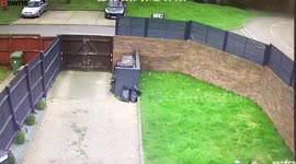 Shocking moment delivery driver hurls ASOS parcel 25ft over a garden fence