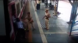 Man is knocked down trying to walk off moving train at Mumbai station