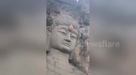 Wasps build nest on forehead of giant Buddha statue in China's Hangzhou