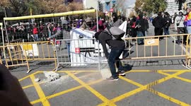Catalan demonstrators build a barricade in Barcelona