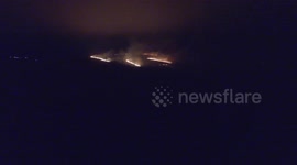 Fire fighters tackle large blaze on Crompton Moor in Oldham, UK