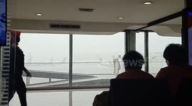 rain and strong winds scared the heart in the airport waiting room at Soerkarno Hatta to fly Jakarta - Surabaya
