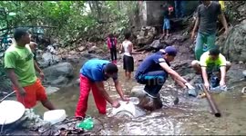 Residents bath in river stream amid nationwide blackouts in stricken Venezuela