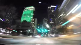Timelapse footage shows drive through downtown Miami at night