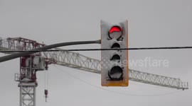 Traffic lights covered in snow creating a safety hazard for drivers after spring snow storm hit Toronto area this weekend