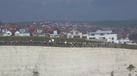 Moment 400 people gathered with mirrors on England's south coast to reflect SOS signal to Europe