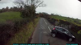 Car rolls over on Welsh country lane right in the path of oncoming lorry